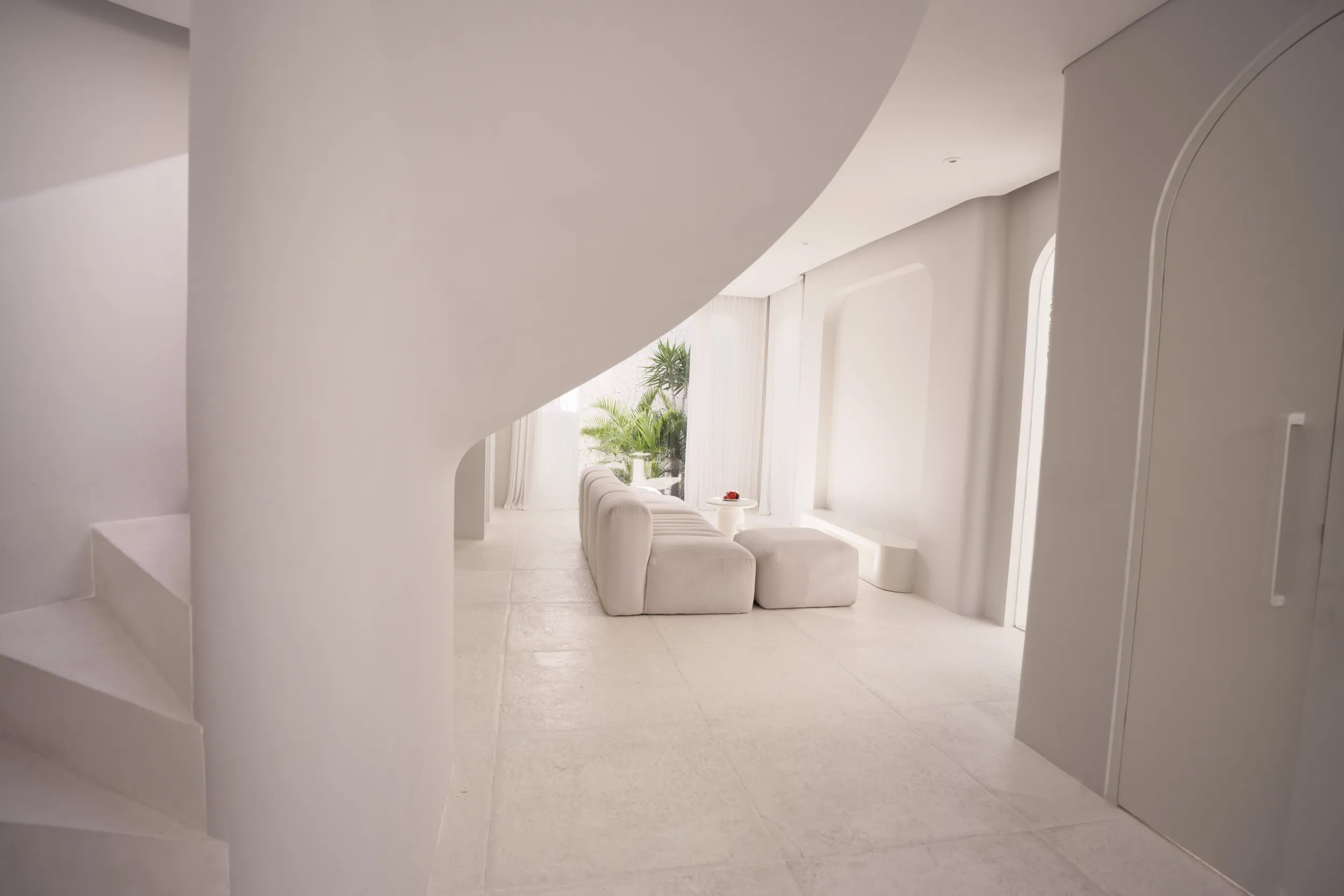 Spaces and architecture: sculptural white staircase and living space