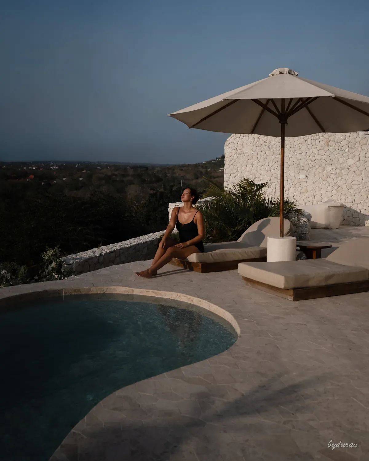 Villa poolside — golden hour portrait overlooking the hills
