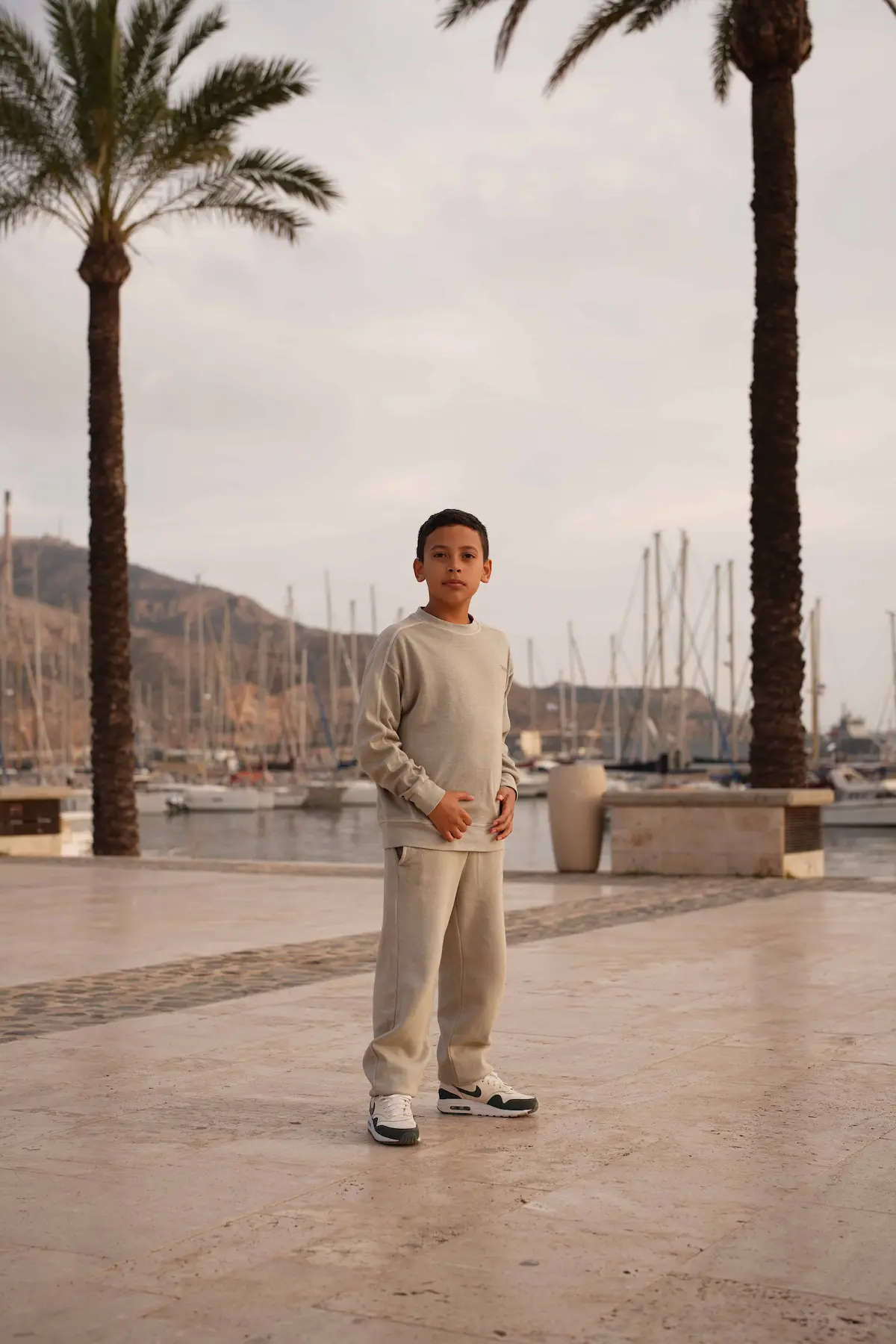 Lifestyle — Rico standing, warm light