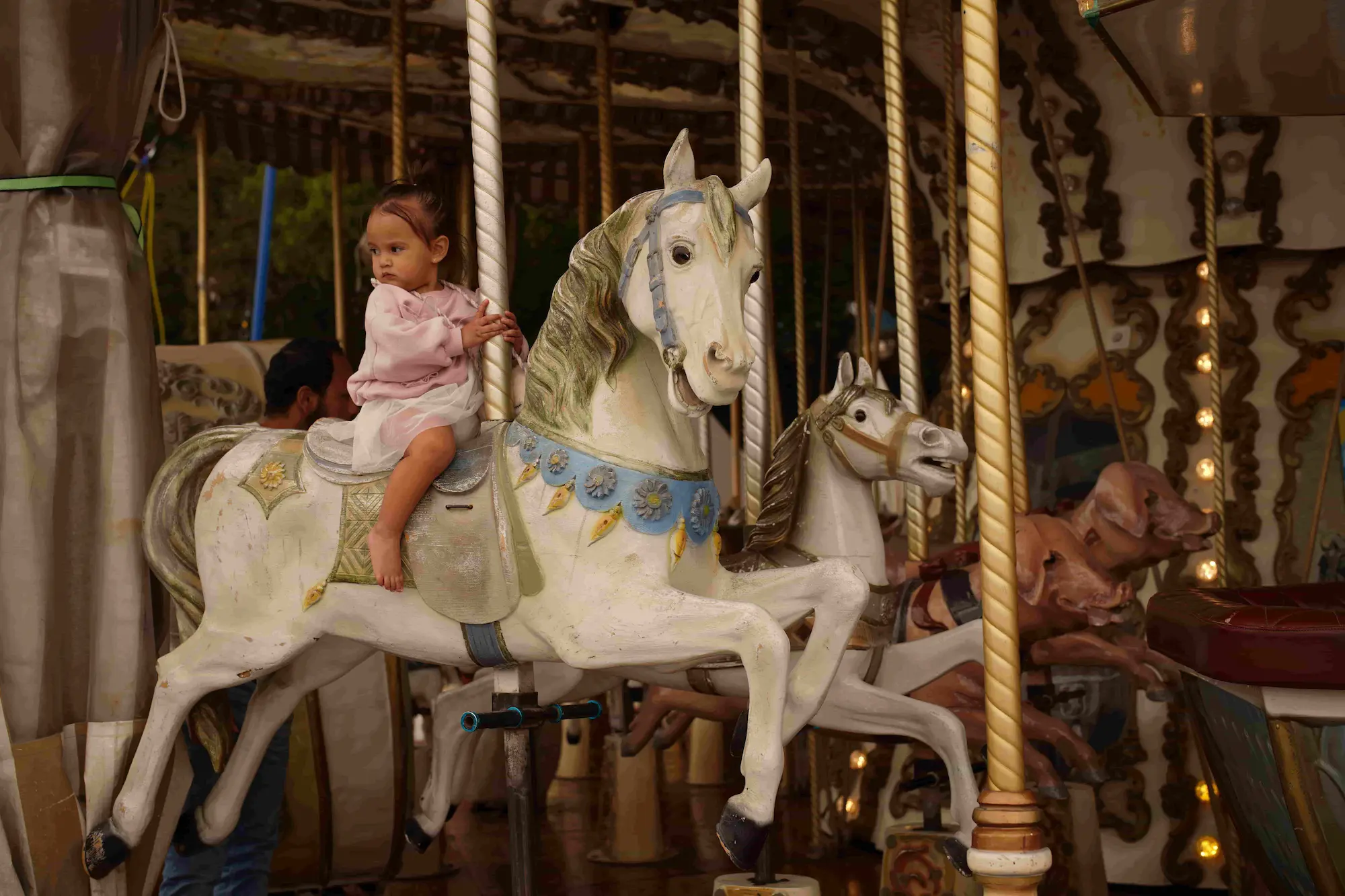 Risa with a horse at a destination — byduran family travel